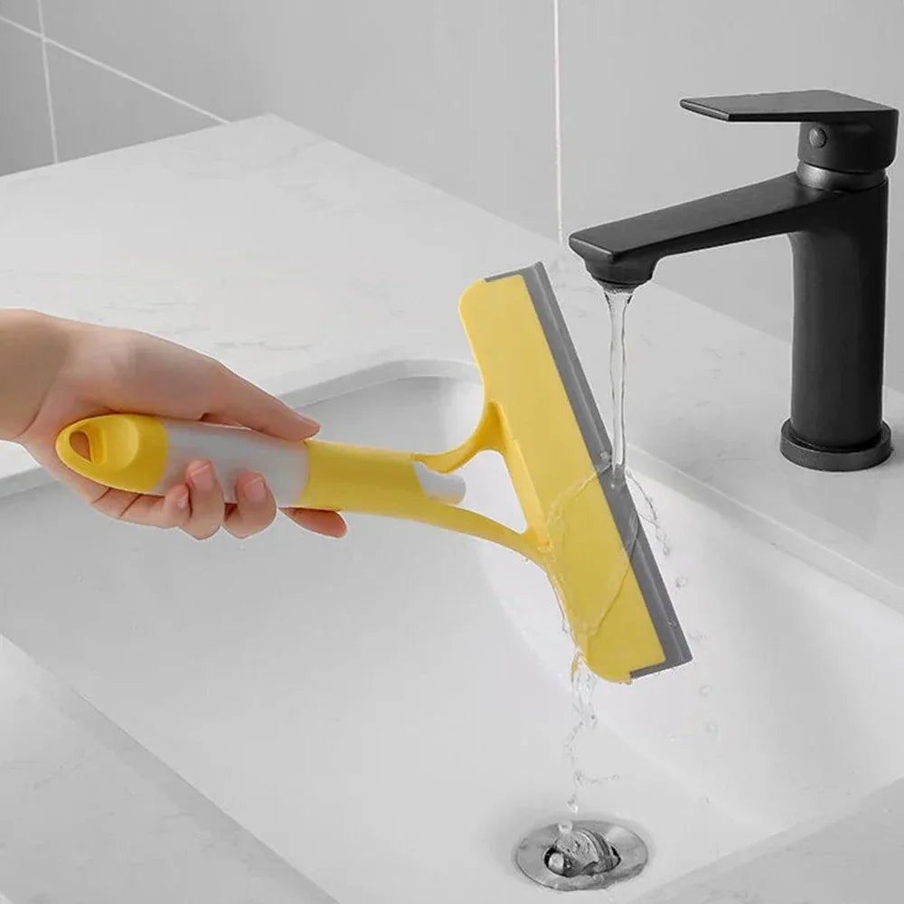 A household glass cleaning scraper that combines the functions of a watering can and a window scraper.